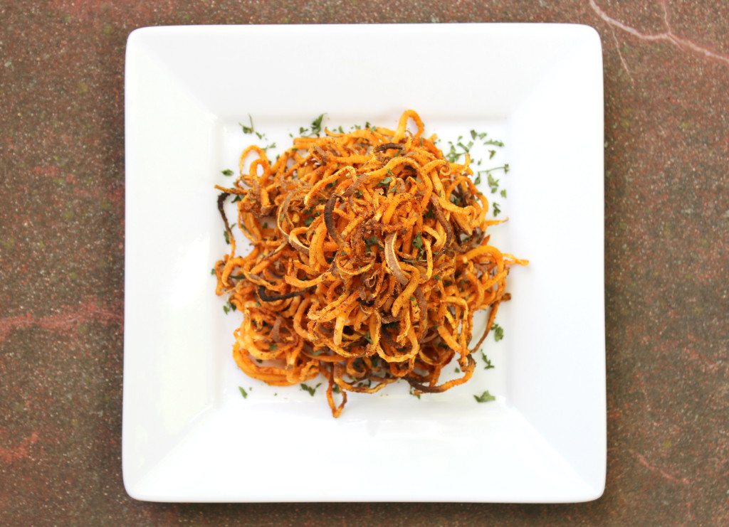 Spicy Spiralized Sweet Potato Fries | Strength and Sunshine @RebeccaGF666 Take your fries to a whole new level. These spicy sweet potato fries are spiralized and baked for the ultimate crispness and seasoned to a spiciness of your liking. Gluten-free, vegan, allergy-free, paleo, and Whole 30 approved, these fries will make your summer cook-outs a little livelier!