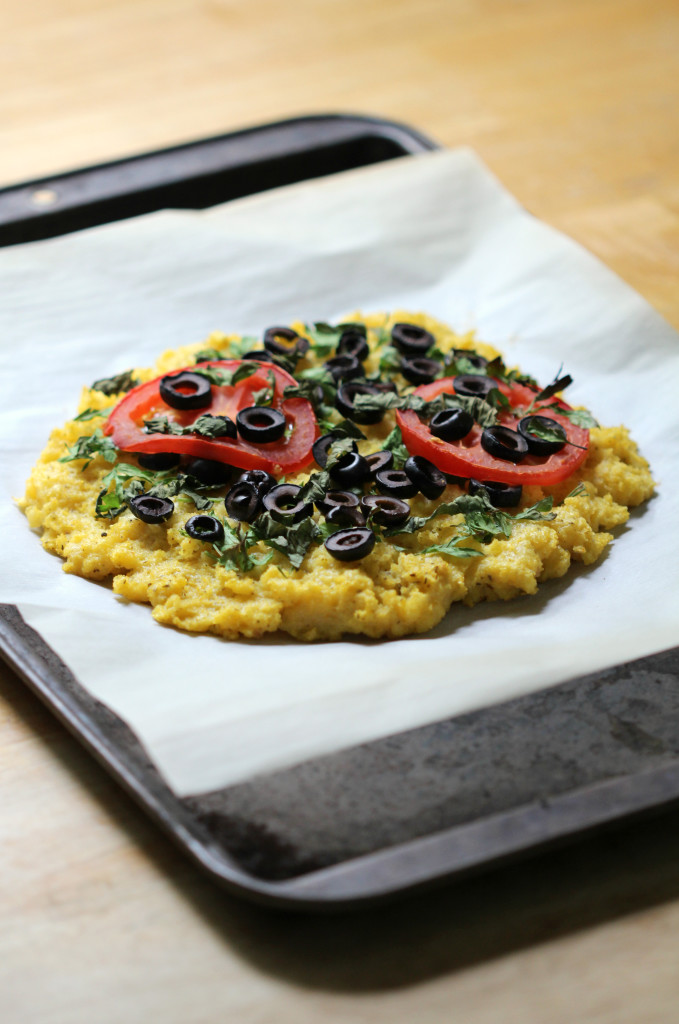 Italian Polenta Pizza | Strength and Sunshine @RebeccaGF666 A simple polenta crust pizza topped with fresh basil, parsley, sliced black olives and ripe red tomato. An Italian classic made gluten-free and vegan without missing one hint of flavor! #CalOlivesMedRecipe