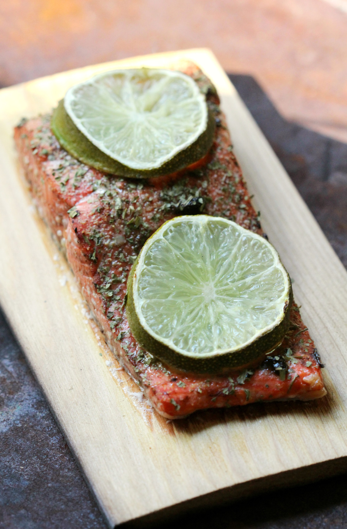 Black Garlic & Lime Cedar Plank Salmon | Strength and Sunshine @RebeccaGF666 Black garlic and lime add even more flavor to smoky grilled cedar plank salmon. You won't have to wait long for this paleo and gluten-free recipe to be cooked up; it's done in a snap and will surly satisfy! Perfect for a quick dinner or lunch!
