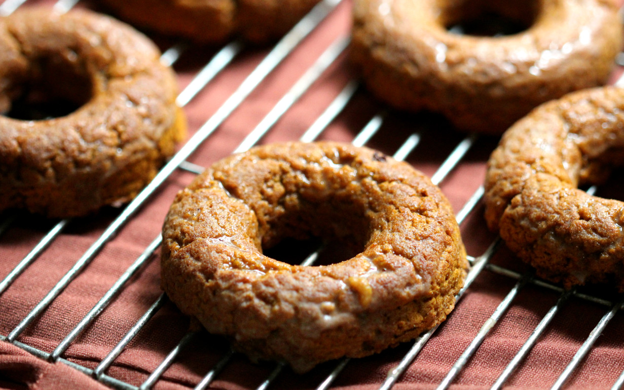 Cinnamon Glazed Pumpkin Doughnuts | Strength and Sunshine @RebeccaGF666 Your morning coffee companion just got sweeter. Cinnamon Glazed Pumpkin Doughnuts, baked to perfection and loaded with pumpkin. Gluten-free, vegan, and paleo, the flavors of fall will keep everyone warm and cozy!