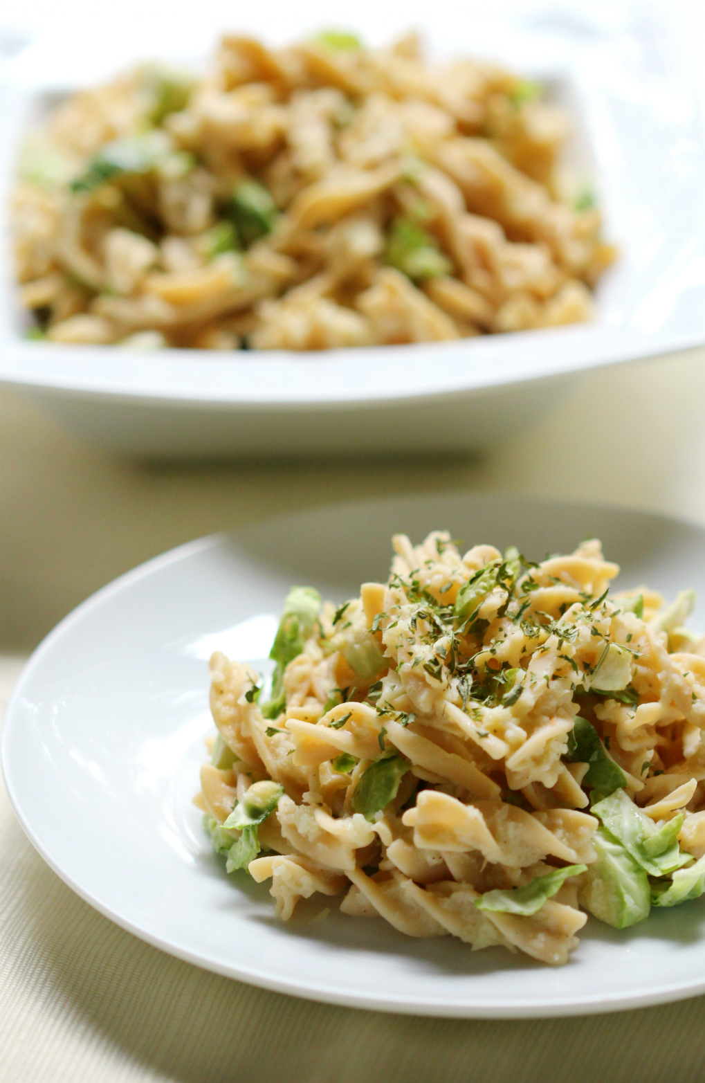 Rotini Pasta Alfredo with Shaved Brussels Sprouts | Strength and Sunshine @RebeccaGF666 A healthy veggie-packed, grain-free rotini pasta Alfredo that you won't know is gluten-free or vegan! The ultimate comfort food dinner recipe you can make to nourish the whole family (and get them to eat brussels sprouts)!