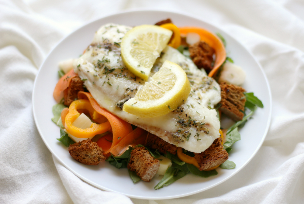 Lemon Pepper Tilapia + Spring Arugula Salad & Homemade Garlic Herb Croutons | Strength and Sunshine @RebeccaGF666 A simple spring weeknight dinner recipe for lemon pepper tilapia with a fresh arugula salad and homemade gluten-free, dairy-free garlic herb croutons! Ready in 20 minutes or less so you have time to sit down and enjoy!