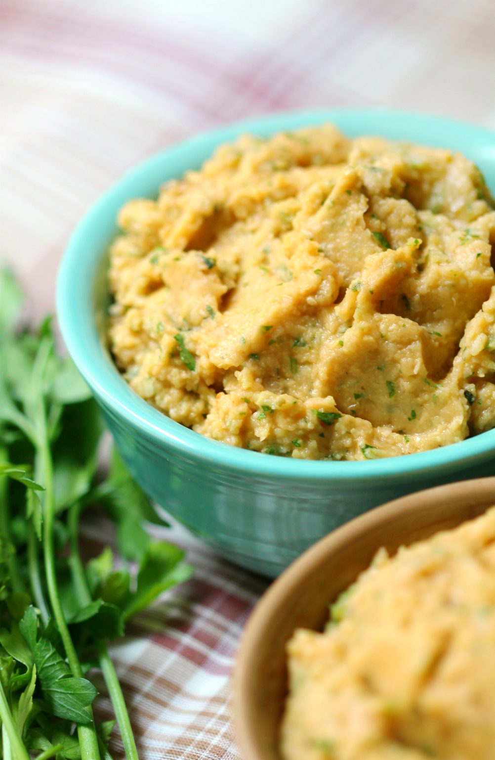 Spicy Garden Carrot Hummus | Strength and Sunshine @RebeccaGF666 A zesty dip or spread to pack in the veggies! Spicy garden carrot hummus is gluten-free & vegan without the oil. A healthy seasonal take to use your garden's fresh carrots and herbs in a crowd-pleasing favorite recipe!
