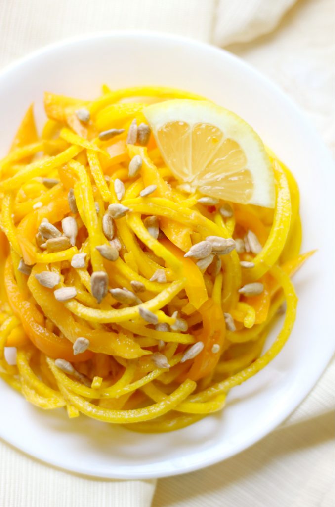 Sunshine Spiralized Beet Salad | Strength and Sunshine @RebeccaGF666 Spiralized golden beets, mango, and sweet bell pepper with a sunflower seed dressing, screams sunshine! This spiralized beet salad is gluten-free, vegan, nut-free, and paleo! A beautiful side dish recipe that's sure to make you smile!
