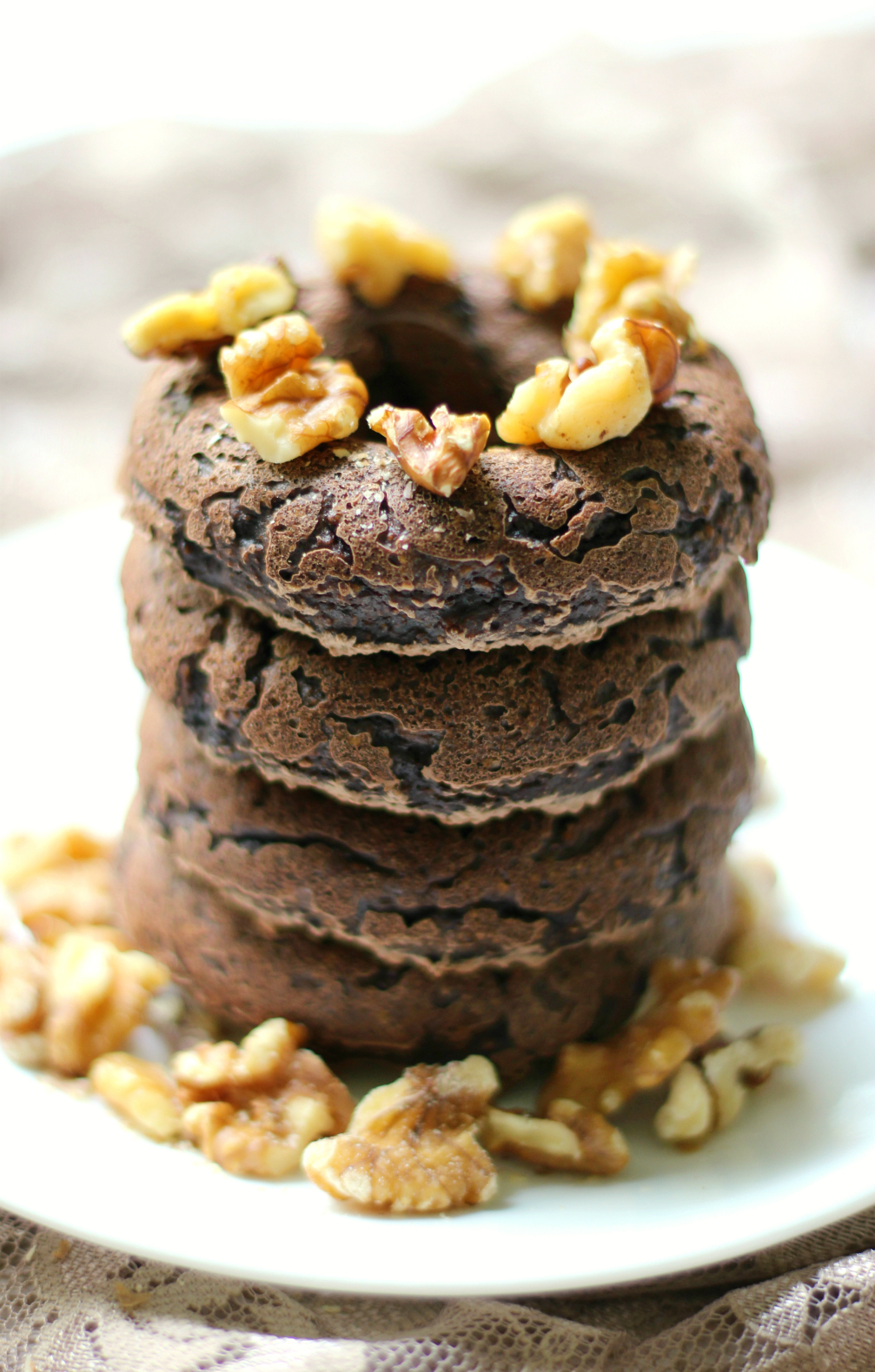 Dark Chocolate Walnut Doughnuts | Strength and Sunshine @RebeccaGF666 Decadent, but secretly healthy, Dark Chocolate Walnut Doughnuts! These gluten-free, vegan, & paleo doughnuts are baked breakfast perfection! Serve them with a cup of coffee or your afternoon tea! sponsored #SilkCrowd #Nutchello #lovemysilk @Silk