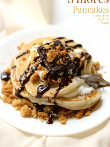 S'mores Pancakes | Strength and Sunshine @RebeccaGF666 Who says you can't have s'mores for breakfast? This gluten-free, soy-free, vegan recipe for s'mores pancakes doesn't require the campfire and won't give you a sugar crash! Young or old, everyone will love a stack of these healthy s'mores pancakes!