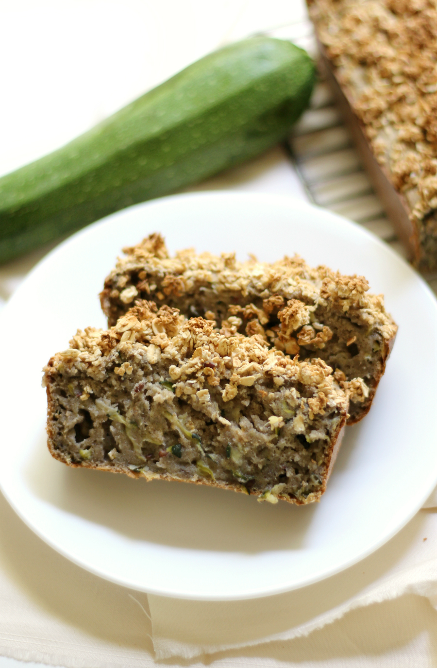 Gluten-Free Zucchini Bread with Maple Oat Crumble | Strength and Sunshine @RebeccaGF666 A classic with a twist! Gluten-Free Zucchini Bread with Maple Oat Crumble! A vegan, healthy, and more delicious way to bake your favorite summer quick bread recipe. Moist slices of zucchini bread with the comforting flavors of warm maple and oven-toasted oats!