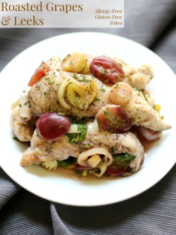 Skillet Chicken with Roasted Grapes & Leeks | Strength and Sunshine @RebeccaGF666 Savory with a subtle deep sweetness, this Cast Iron Skillet Chicken with Roasted Grapes & Leeks is a soul-soothing healthy, allergy-free, gluten-free, paleo dinner recipe that the whole family will enjoy!