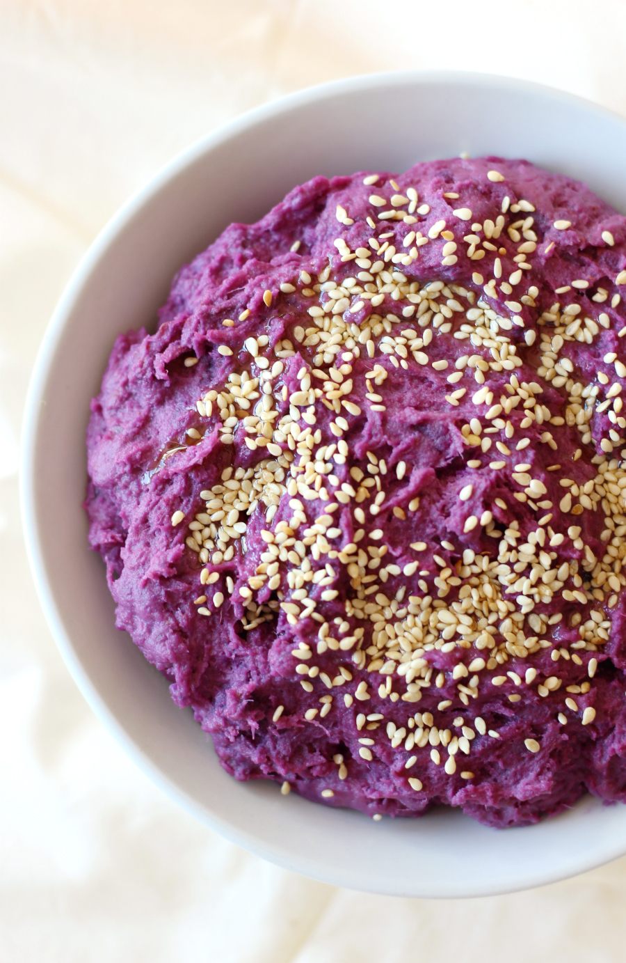 Tahini Mashed Purple Sweet Potatoes | Strength and Sunshine @RebeccaGF666 There's nothing quite as comforting as a plate of mashed potatoes, but it's time to take it up a notch! Tahini Mashed Purple Sweet Potatoes will blow the traditional side dish out of the park! This recipe is gluten-free, vegan, paleo, and top 8 allergy-free! This purple mash will be the star of any family dinner!