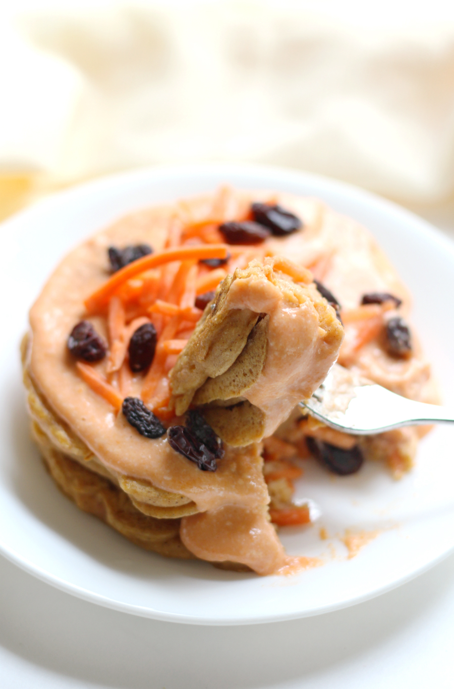 Carrot Cake Pancakes with Carrot Cream Frosting (Gluten-Free, Allergy-Free, Vegan) | Strength and Sunshine @RebeccaGF666 Everything you love about carrot cake, now as a healthy breakfast! These Carrot Cake Pancakes with Carrot Cream Frosting are gluten-free, allergy-free, vegan, and sneak in tons of veggie nutrition! This recipe is just what you need to welcome Spring!