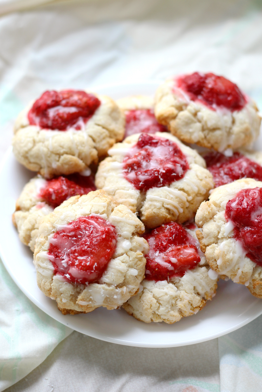 Paleo Strawberry Coconut Thumbprint Cookies (Gluten-Free, Vegan) | Strength and Sunshine @RebeccaGF666 Celebrate the Spring with a batch of Paleo Strawberry Coconut Thumbprint Cookies that are gluten-free, vegan, and grain-free! A fruity dessert recipe you'll be baking up beyond the season! ad 