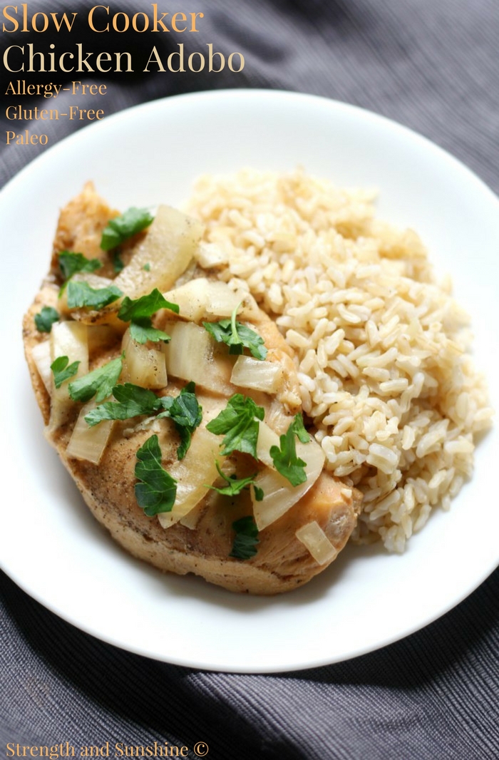 Slow Cooker Chicken Adobo (Gluten-Free, Paleo, Allergy-Free) | Strength and Sunshine @RebeccaGF666 A classic Filipino recipe now made gluten-free, paleo, top-8 allergy-free, and in the crockpot! This healthy Slow Cooker Chicken Adobo is perfectly tender and tangy with its combination of vinegar and coconut aminos in place of the typical soy sauce! #glutenfree #paleo #slowcooker #chicken #chickenadobo #soyfree #crockpot #dinner