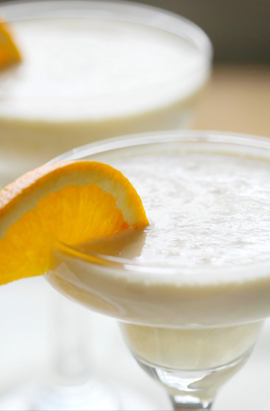 4-Ingredient Orange Julius Cocktail (Gluten-Free, Vegan) | Strength and Sunshine @RebeccaGF666 Give your Orange Julius a grown-up boozy twist! A quick and easy 4-Ingredient Orange Julius Cocktail recipe that's gluten-free, vegan, and makes for a perfect frozen, creamy, and fruit treat! A sippable Creamsicle for adults only! #orangejulius #creamsicle #cocktail #glutenfree #vegan 