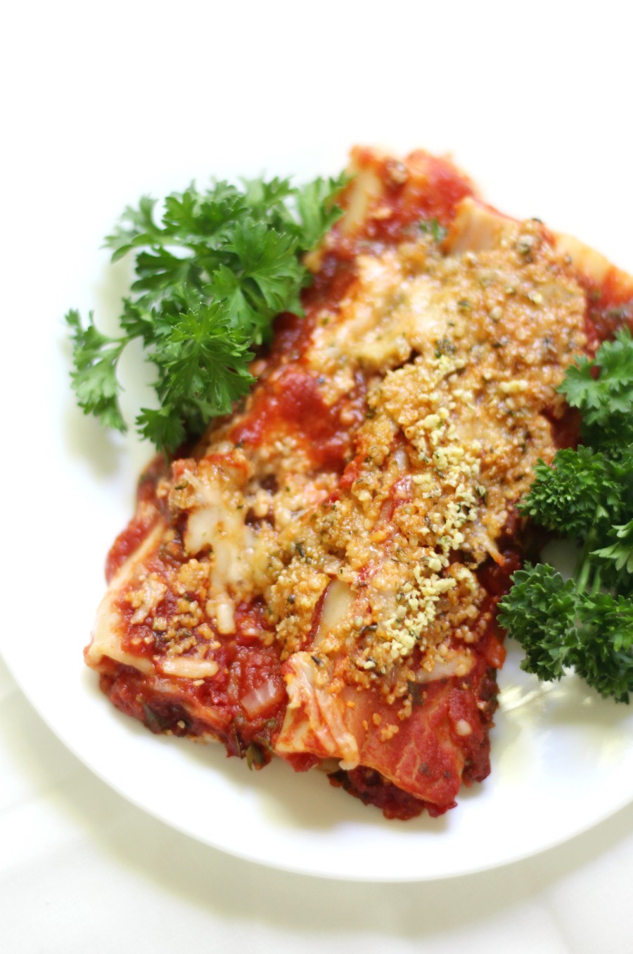 Classic Baked Gluten-Free + Vegan Manicotti (Soy-Free) | Strength and Sunshine @RebeccaGF666 No more missing out on your Italian favorite! A Classic Baked Gluten-Free & Vegan Manicotti recipe with homemade tomato sauce, a creamy dairy-free & soy-free cheesy filling, all topped with a homemade 2-ingredient "parmesan"! A perfect comfort food dinner the whole family will enjoy! #glutenfree #vegan #pasta #dinner #manicotti #dairyfree #soyfree #eggfree #glutenfreepasta