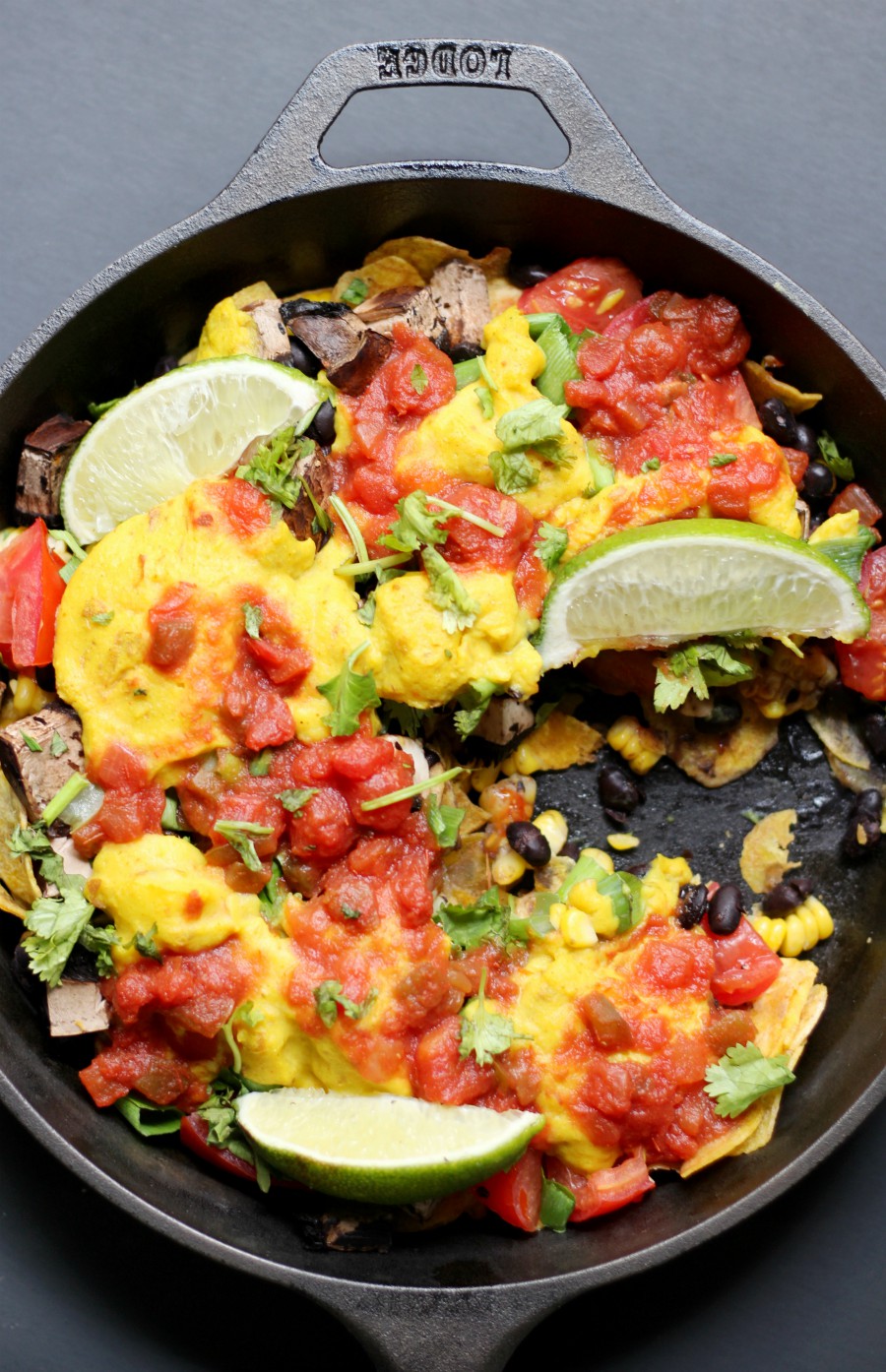 Gluten-Free Skillet Plantain Nachos (Vegan, Grain-Free, Allergy-Free) | Strength and Sunshine @RebeccaGF666 A delicious, messy, plant-based skillet of nachos! Gluten-Free Skillet Plantain Nachos that are vegan, grain-free, and top 8 allergy-free! Loaded with veggies and plantain chips, topped with salsa and an easy homemade vegan cheese sauce recipe, these nachos make for a fun Mexican meal any night of the week! #nachos #glutenfree #vegan #plantains #grainfree #strengthandsunshine