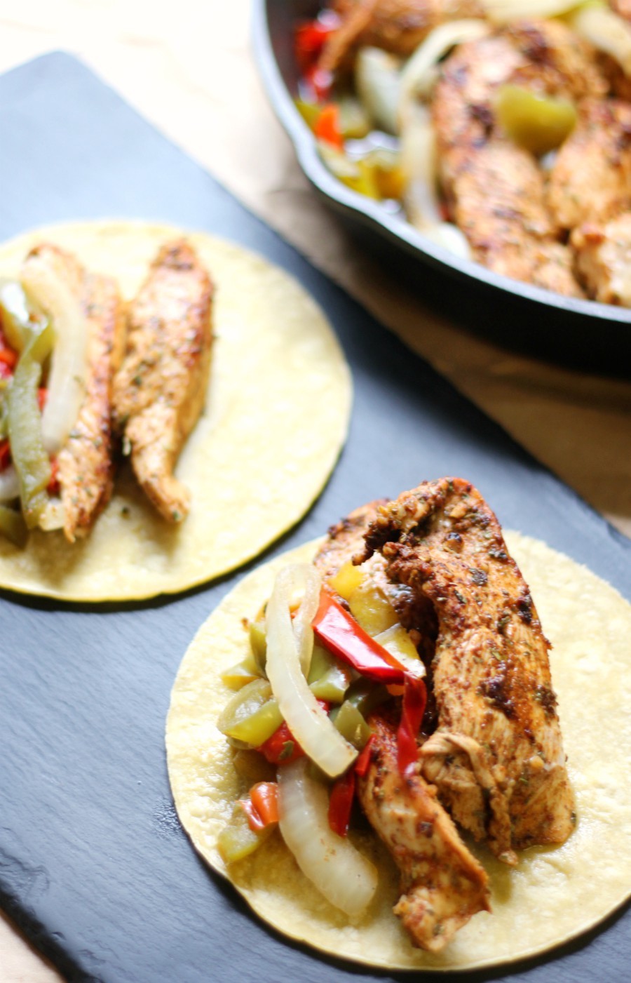Easy Gluten-Free Skillet Chicken Fajitas (Allergy-Free, Paleo) | Strength and Sunshine @RebeccaGF666 Delicious and easy Gluten-Free Skillet Chicken Fajitas, healthy and baked in the oven. Just sliced spiced rubbed chicken, bell peppers, and onions! An allergy-free and paleo Tex-Mex recipe you can make for dinner or prep ahead of time for quick lunches and meals throughout the week!