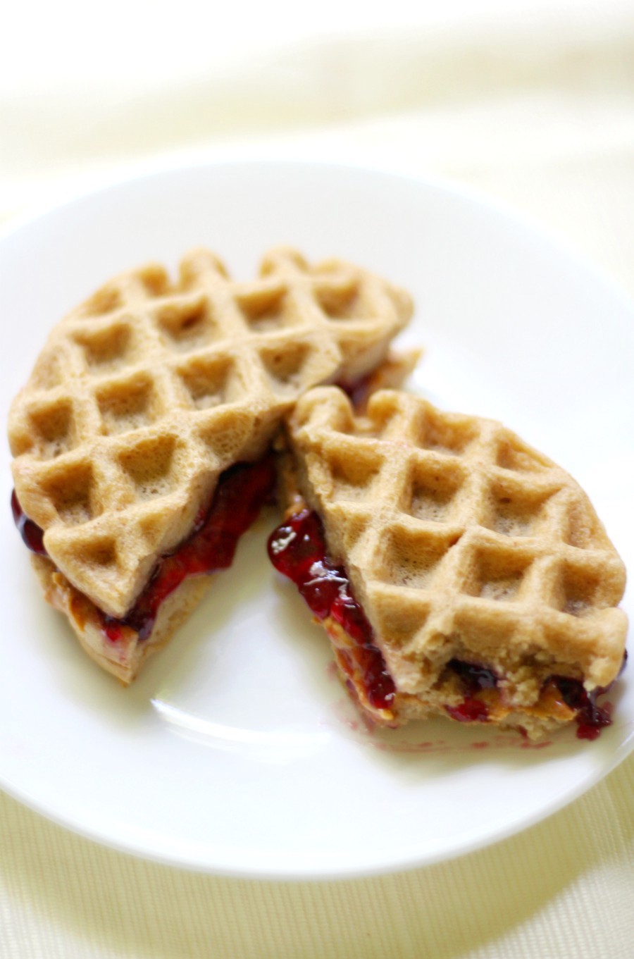 Mini Gluten-Free Peanut Butter & Jelly Waffle Sandwiches (Vegan) | Strength and Sunshine @RebeccaGF666 Breakfast, lunch, or snack, PB&J is good for any time of day! These Mini Gluten-Free Peanut Butter & Jelly Waffle Sandwiches are vegan, fun for kids & adults, healthy & protein-packed! A recipe for all peanut butter lovers and anyone who wants to shakeup their boring sandwich routine!