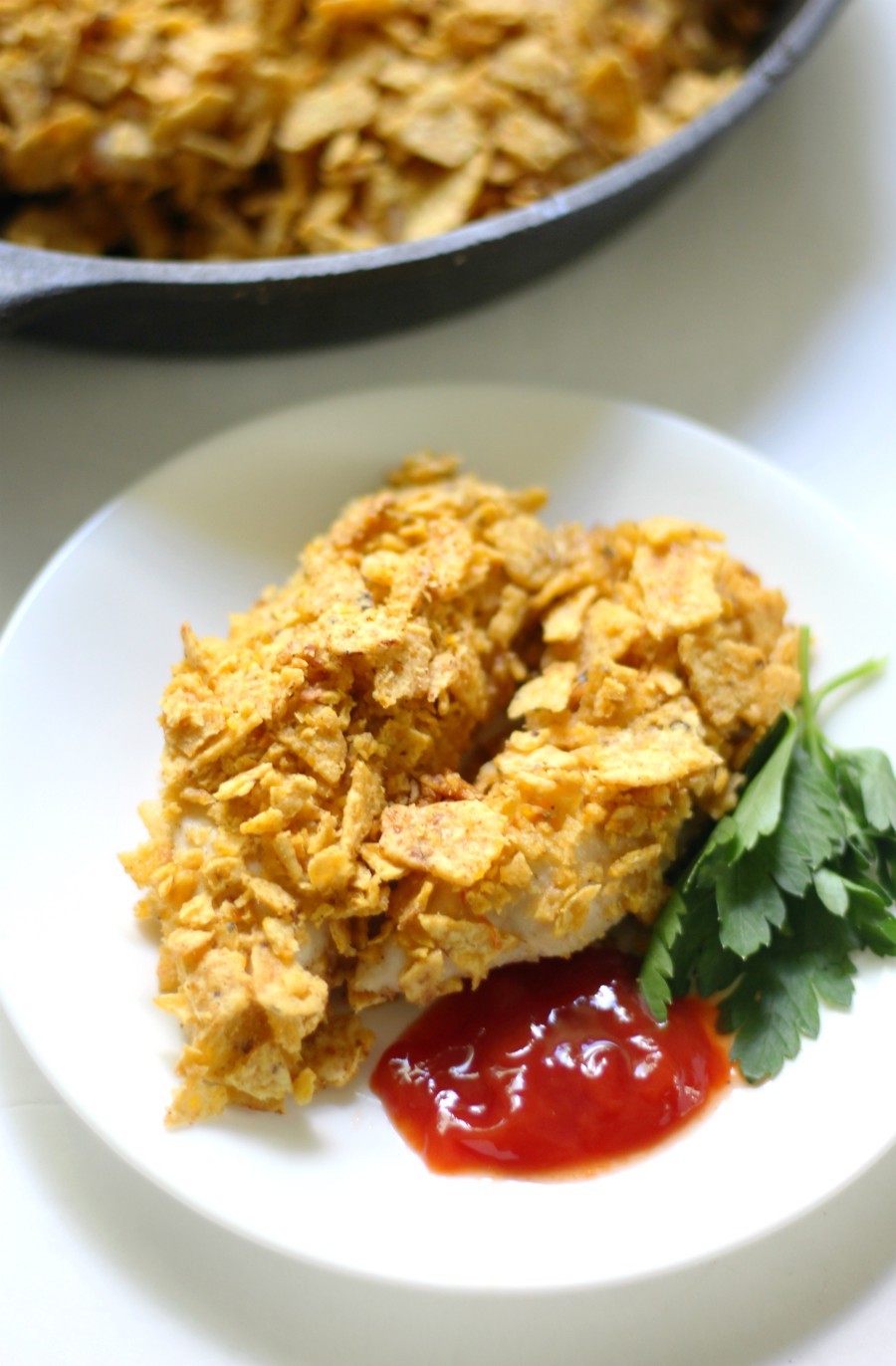 Gluten-Free Tortilla Chip Crusted Chicken Tenders (Allergy-Free) | Strength and Sunshine @RebeccaGF666 Chicken tenders you can feel good about feeding the kids! These healthy Gluten-Free Tortilla Chip Crusted Chicken Tenders are top 8 allergy-free, require no oil, and are baked in the oven. This easy, crispy, crunchy coating with a kick of spice will be your new go-to dinner recipe!