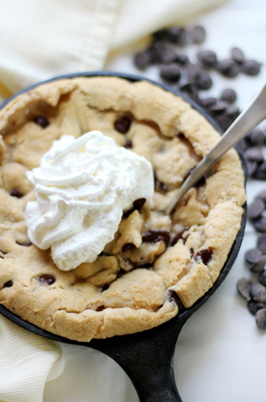 gluten-free-deep-dish-chocolate-chip-skillet-cookie-with-whipped-cream
