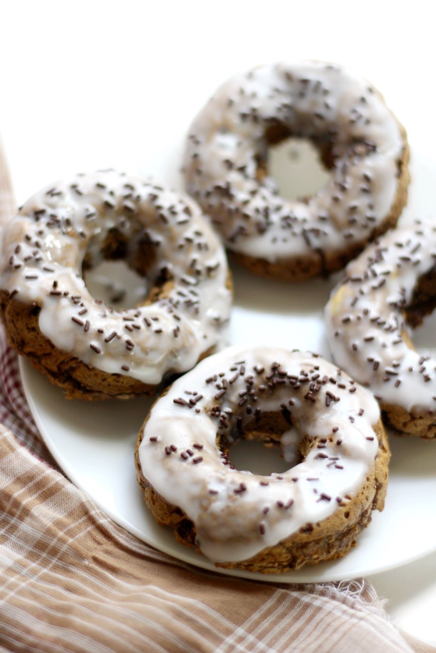 baked-gingerbread-doughnuts-on-white-plate