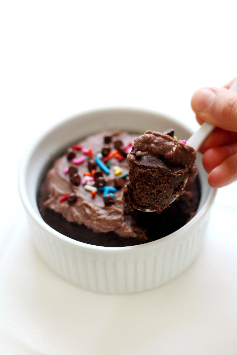 hand-scooping-frosted-gluten-free-vegan-chocolate-buckwheat-mug-cake