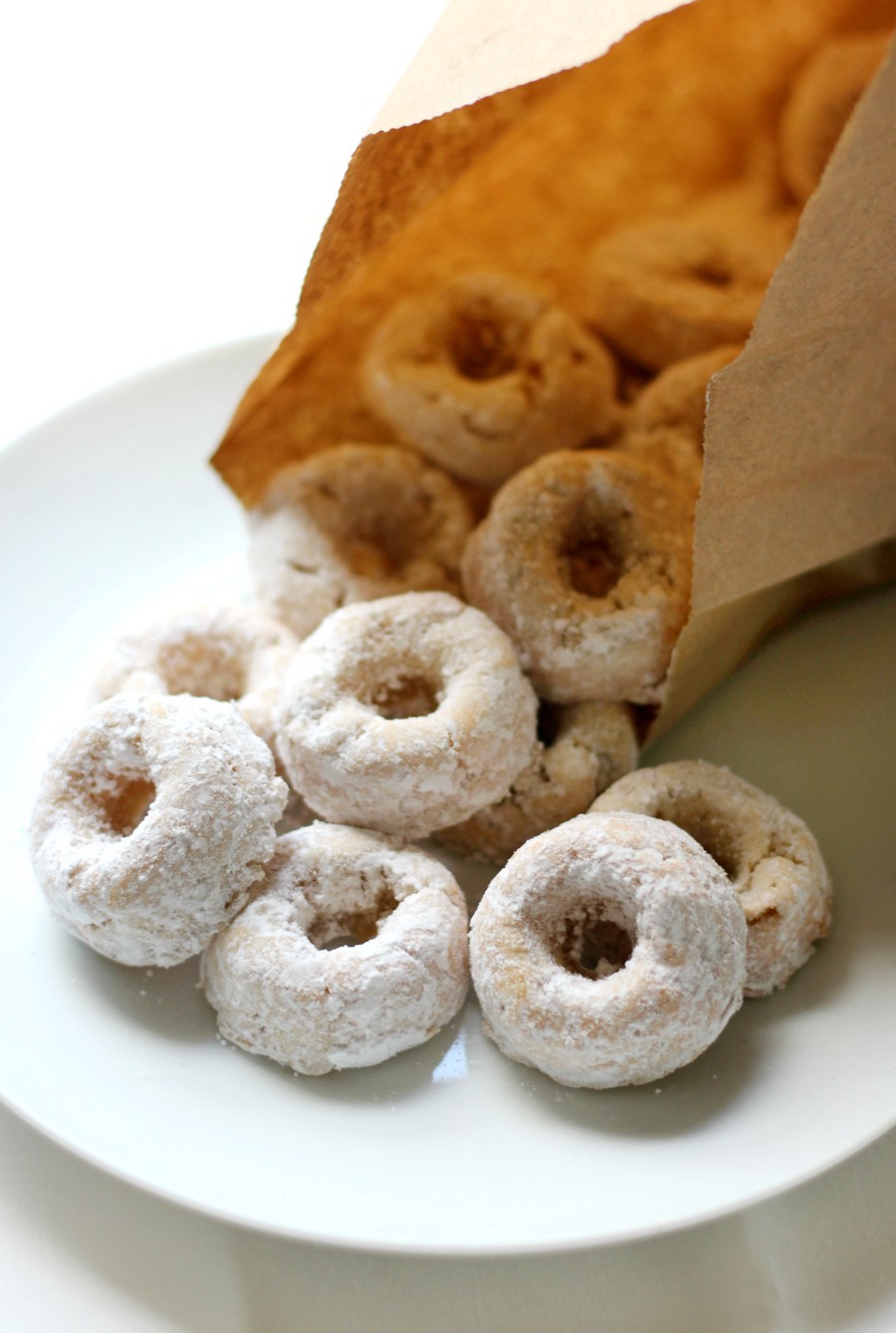 mini-powdered-doughnuts-in-brown-paper-bag
