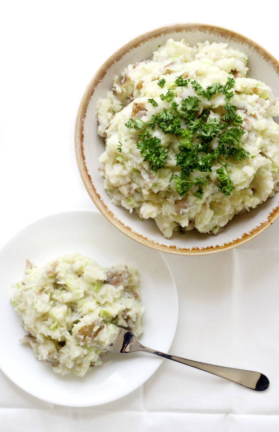 overhead-vegan-irish-colcannon-in-bowl-and-on-white-plate