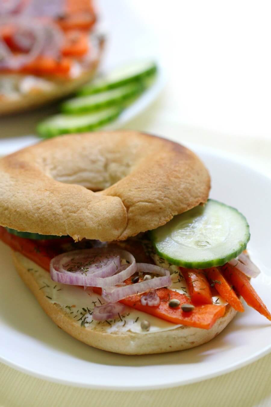 bagel and vegan lox with vegetable toppings