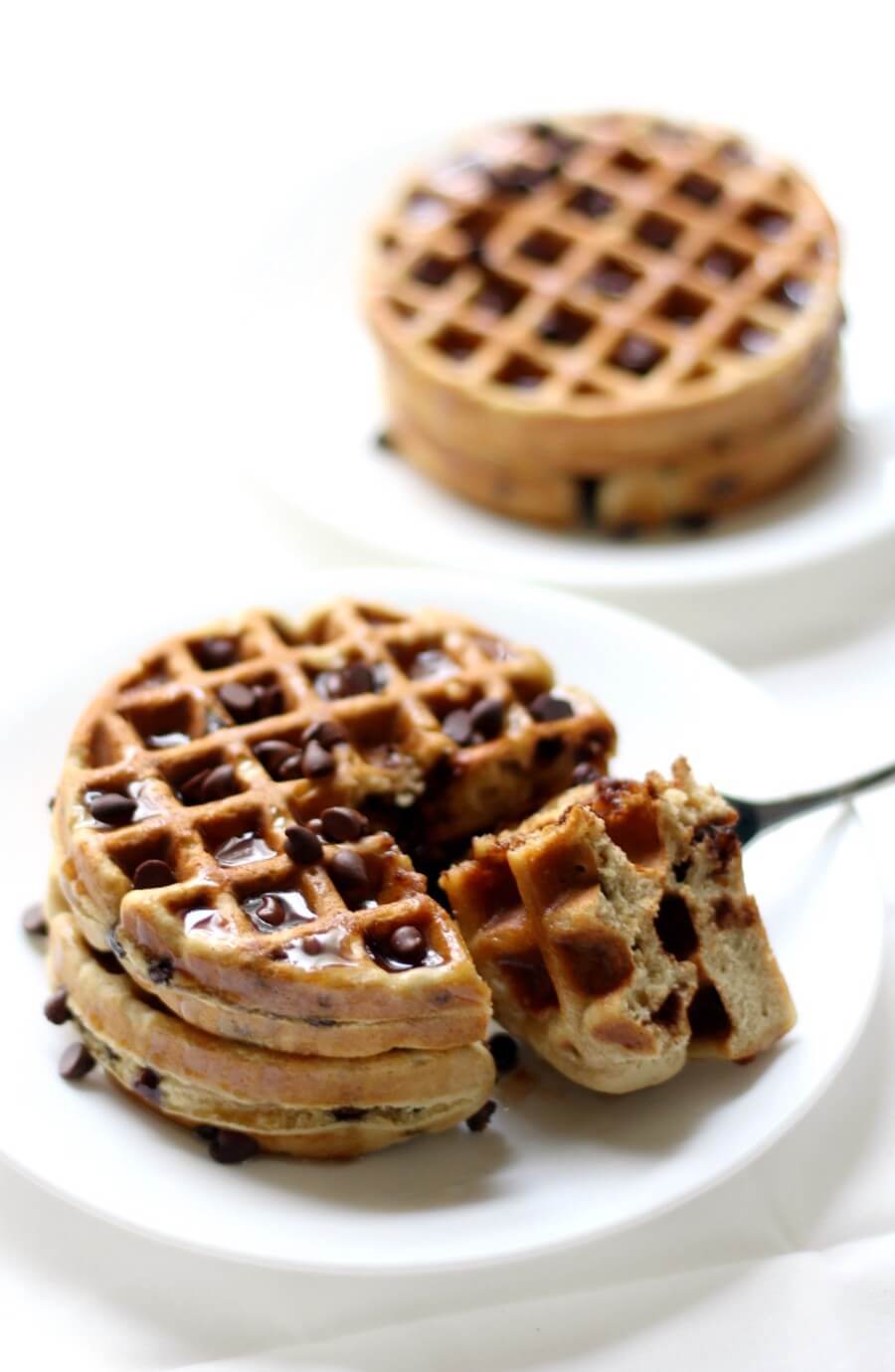 two plates of delicious gluten-free vegan chocolate chip waffles