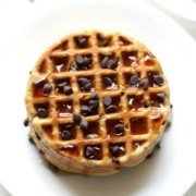 single plate of syrup drenched vegan gluten-free chocolate chip waffles