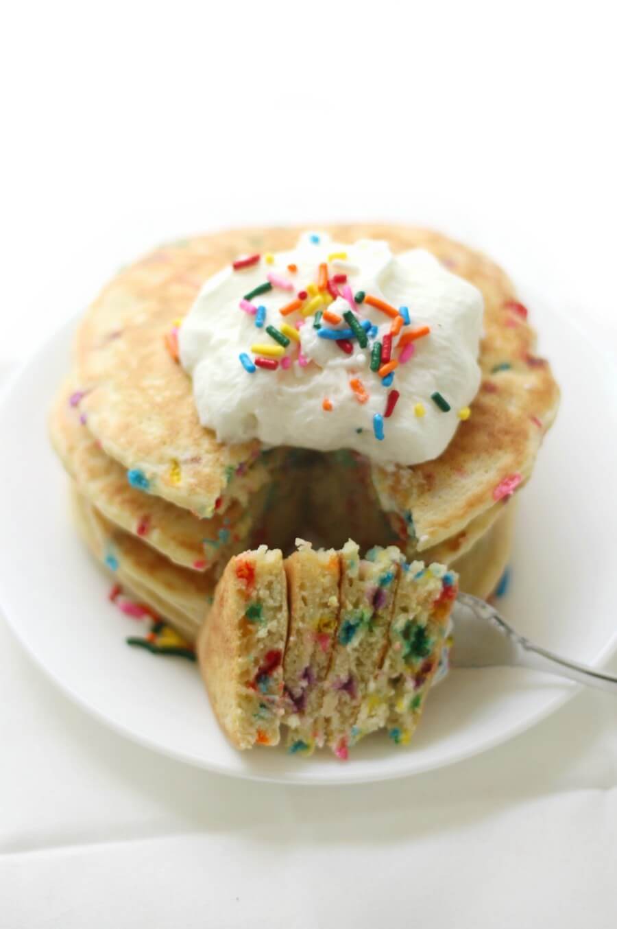 front view of a stack of gluten-free funfetti pancakes