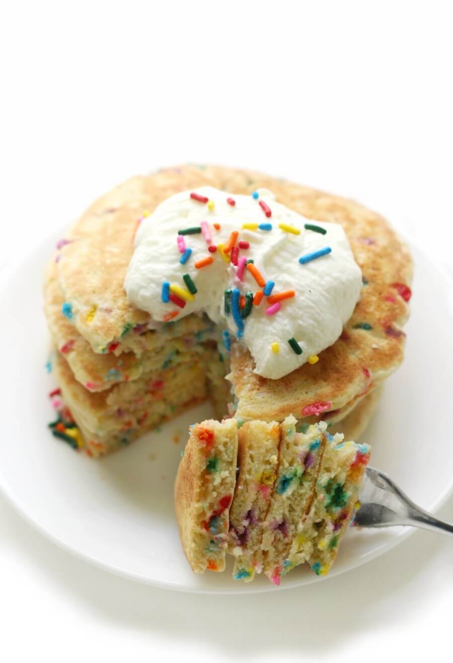stack of gluten-free funfetti pancakes with fork cut
