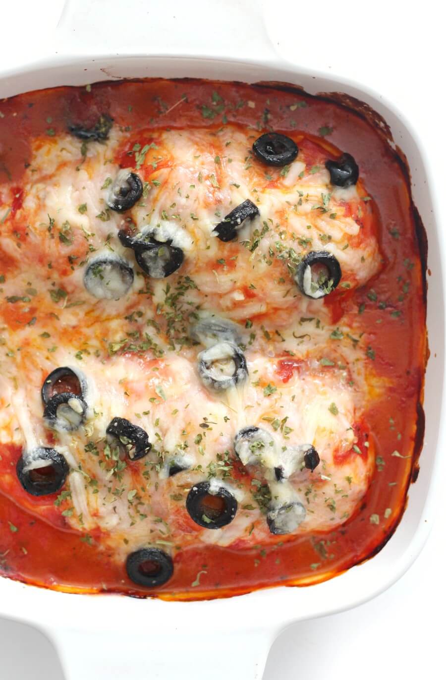 overhead view of dairy-free pizza chicken bake in casserole dish