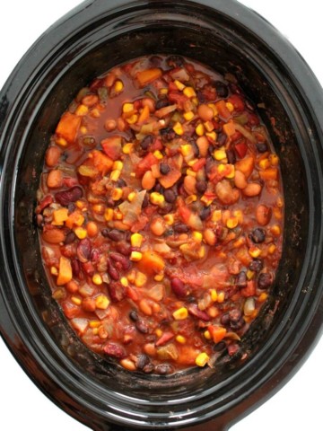 overhead view of slow cooker vegetarian chili in black crockpot