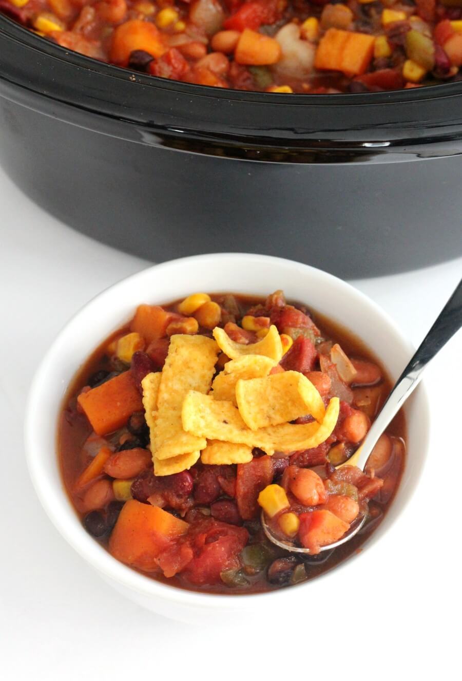 bowl of slow cooker vegetarian chili and crockpot filled with chili