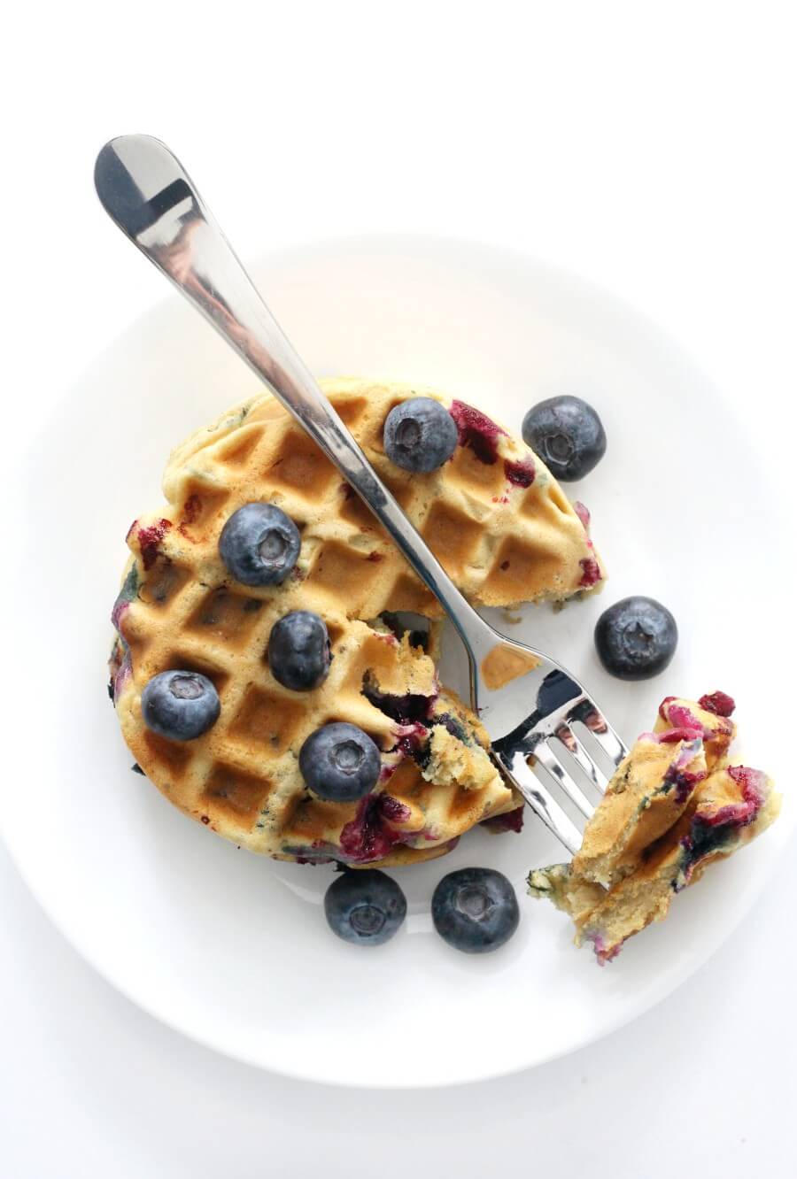 overhead view of plate of gluten-free blueberry waffles served