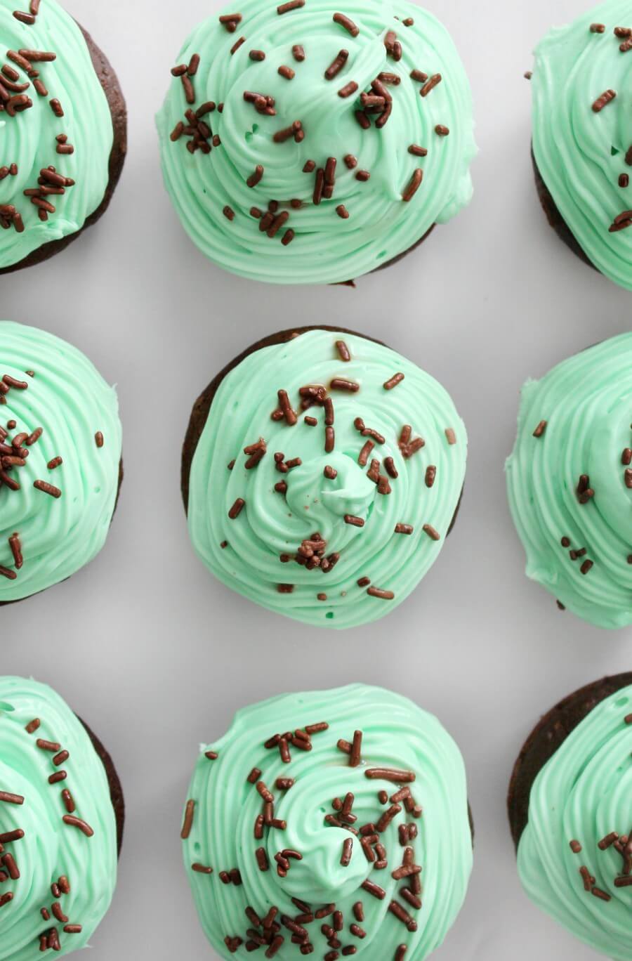 overhead view of gluten-free mint chocolate cupcakes with sprinkles