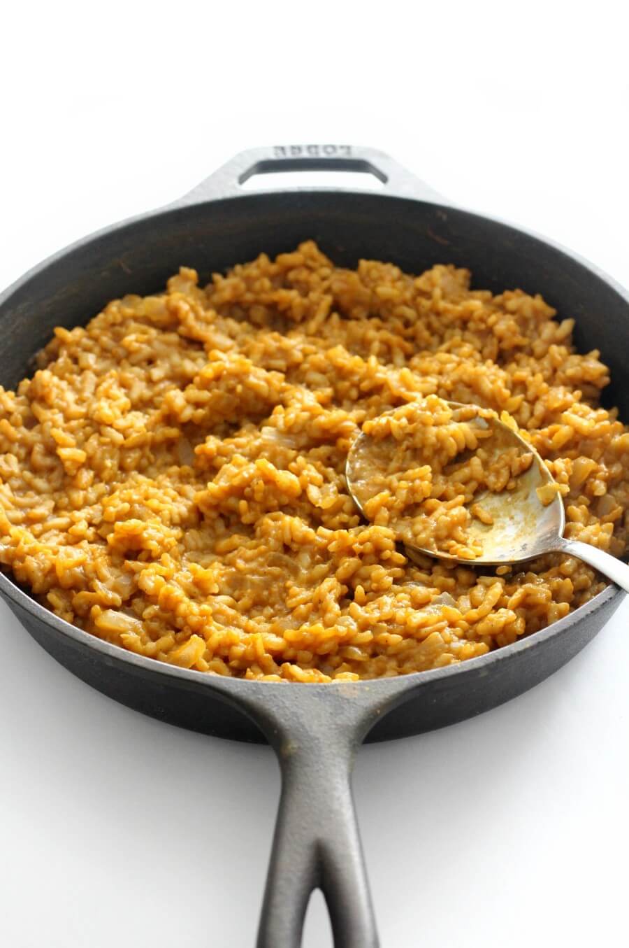 cooked vegan carrot risotto in cast iron skillet