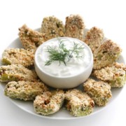 centered plate with breaded artichoke hearts and yogurt dip in middle