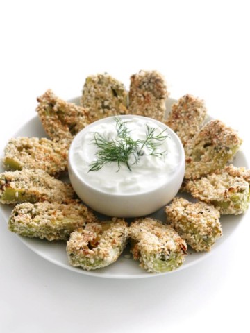 centered plate with breaded artichoke hearts and yogurt dip in middle