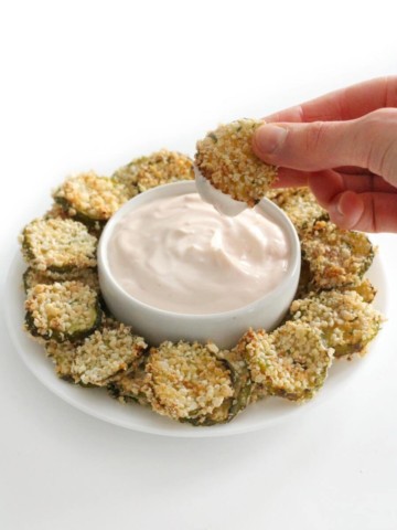 dipped gluten-free air fryer fried pickle in creamy ketchup