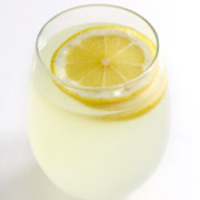single glass of homemade healthy lemonade with lemon slice