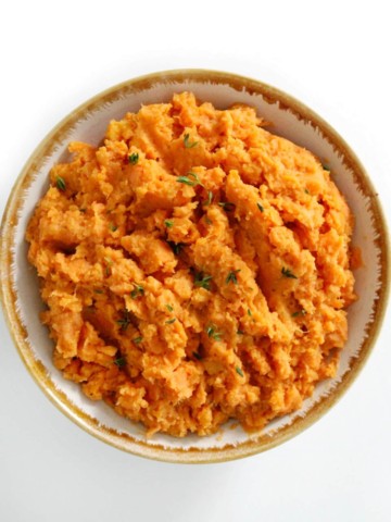 centered overhead image of vegan mashed sweet potatoes in bowl