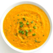 overhead view of finished vegan curried pumpkin soup in bowl