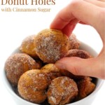 hand grabbing gluten-free pumpkin donut hole from white bowl with image text