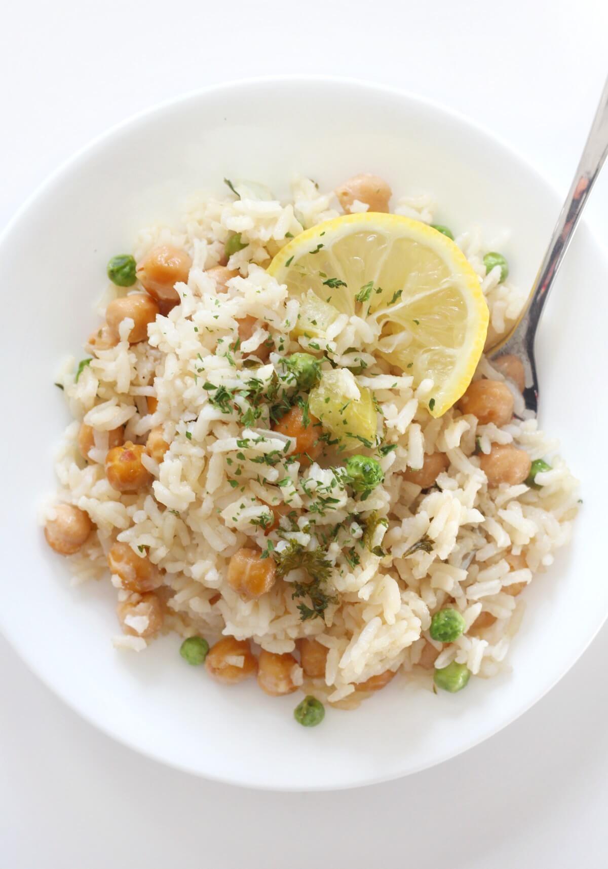 white plate with serving of lemon chickpea and rice casserole