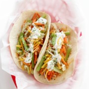 overhead view of vegan buffalo chicken tacos in lined basket
