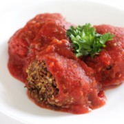 high-protein vegan meatballs with sauce on white plate