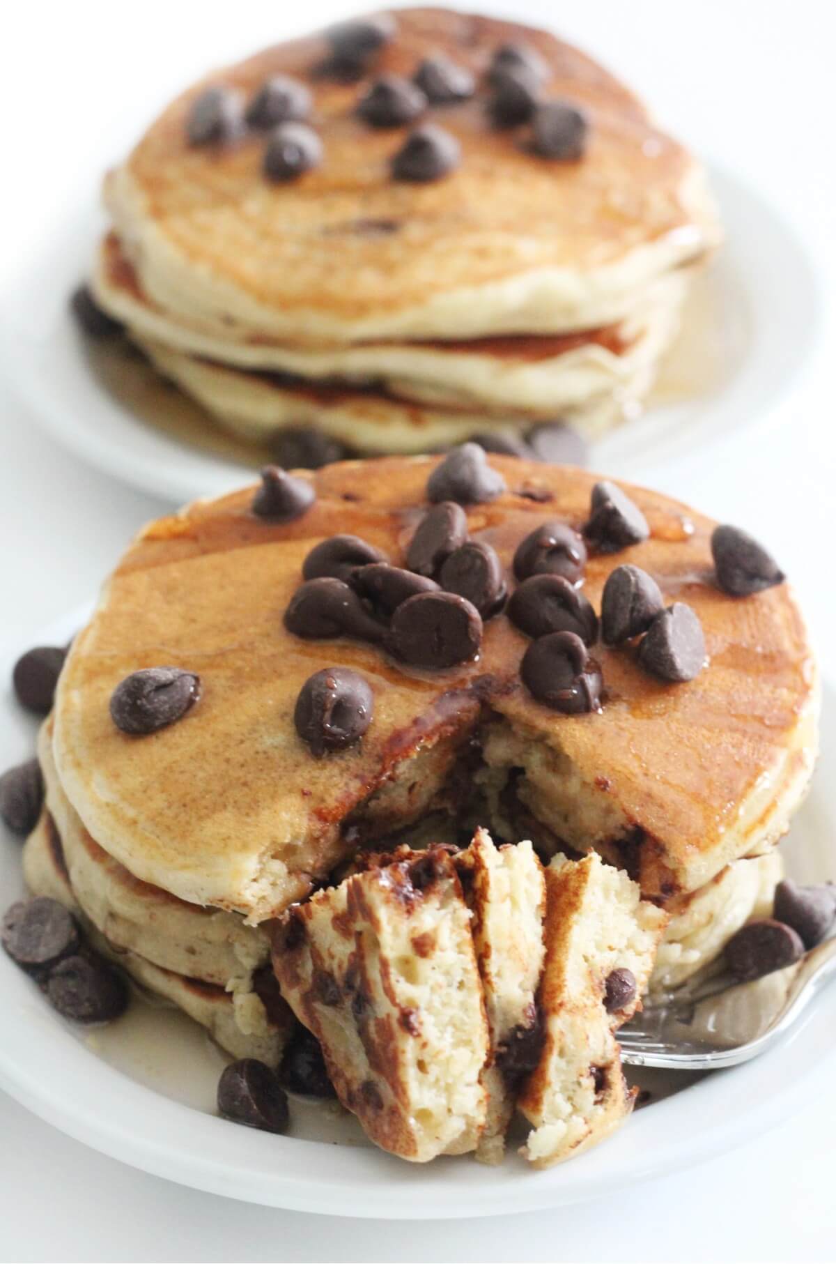 two plates of gluten-free chocolate chip pancakes