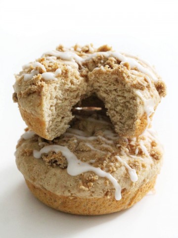 two gluten-free coffee cake doughnuts stacked